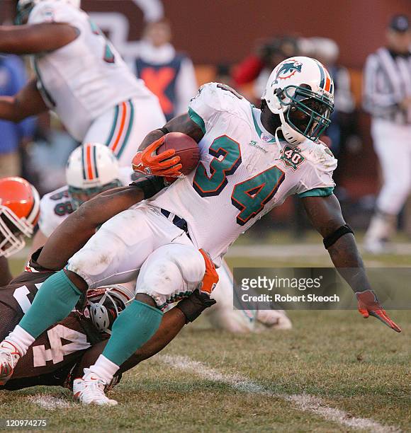 Miami Dolphins running back Ricky Williams scrambles for yards during the game against the Cleveland Browns at Cleveland Browns Stadium in Cleveland...