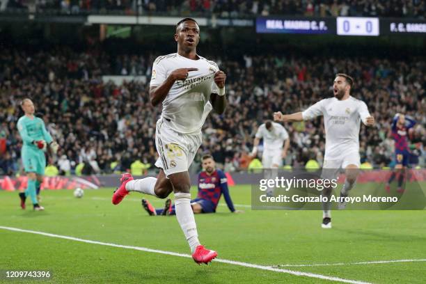 Vinicius Junior of Real Madrid celebrates after scoring his team's first goal during the Liga match between Real Madrid CF and FC Barcelona at...