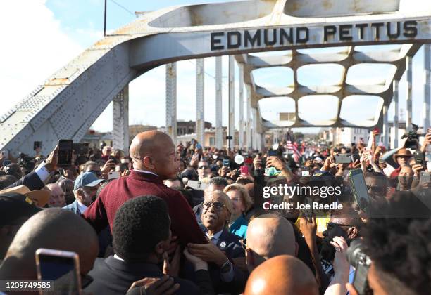 Rep. John Lewis speaks to the crowd at the Edmund Pettus Bridge crossing reenactment marking 55th anniversary of Selma's Bloody Sunday on March 1,...