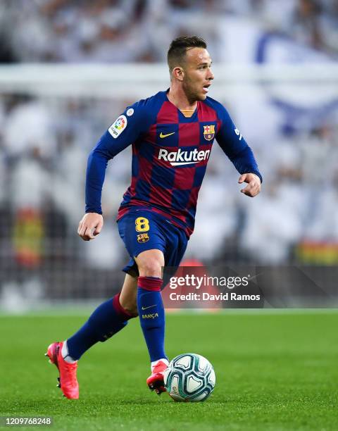 Arthur Melo of FC Barcelona runs with the ball during the Liga match between Real Madrid CF and FC Barcelona at Estadio Santiago Bernabeu on March...