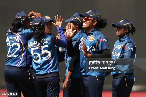 Sri Lanka celebrates taking the wicket of Rumana Ahmed of Bangladesh during the ICC Women's T20 Cricket World Cup match between Sri Lanka and...