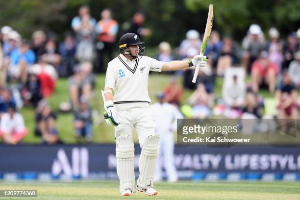Tom Latham of New Zealand celebrates his half century during day three of the Second Test match between New Zealand and India at Hagley Oval on March...