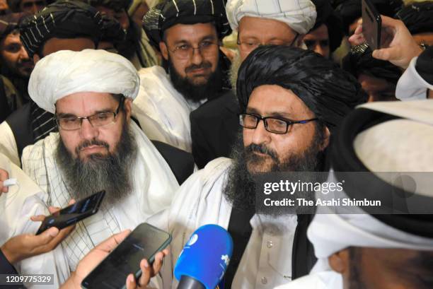 Taliban co-founder Mullah Abdul Ghani Baradar speaks to media reporters after attending the peace agreement signing ceremony between U.S. And Taliban...