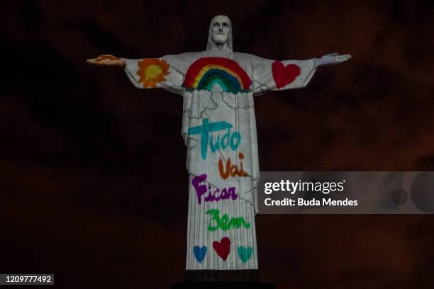 View of the illuminated statue of Christ the Redeemer that reads "Everything will be fine" as Archbishop of the city of Rio de Janeiro Dom Orani...