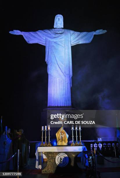 Brazilian Archbishop Orani Joao Tempesta celebrates the Easter Sunday mass by the Christ the Redeemer statue atop Corcovado hill in Rio de Janeiro,...