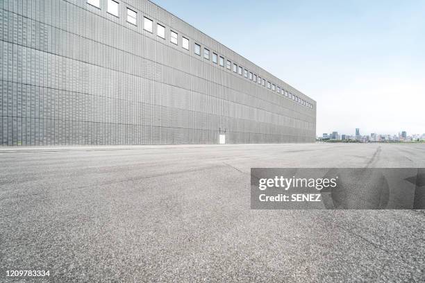 empty parking lot, outdoor warehouse - warehouse exterior stock pictures, royalty-free photos & images