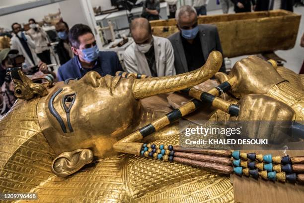 This picture taken on April 13, 2020 shows a view of the golden sarcophagus of the ancient Egyptian Pharaoh Tutankhamun as it lies for restoration at...