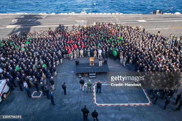 In this handout released by the U.S. Navy, Capt. Brett Crozier, commanding officer of the aircraft carrier USS Theodore Roosevelt , addresses the...