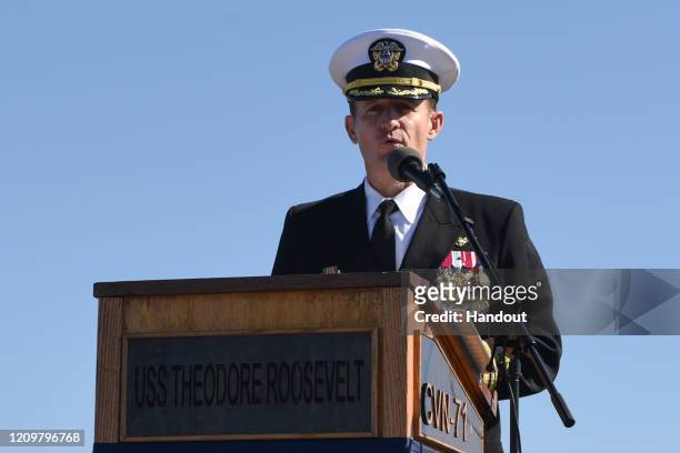 In this handout released by the U.S. Navy, Capt. Brett Crozier addresses the crew for the first time as commanding officer of the aircraft carrier...