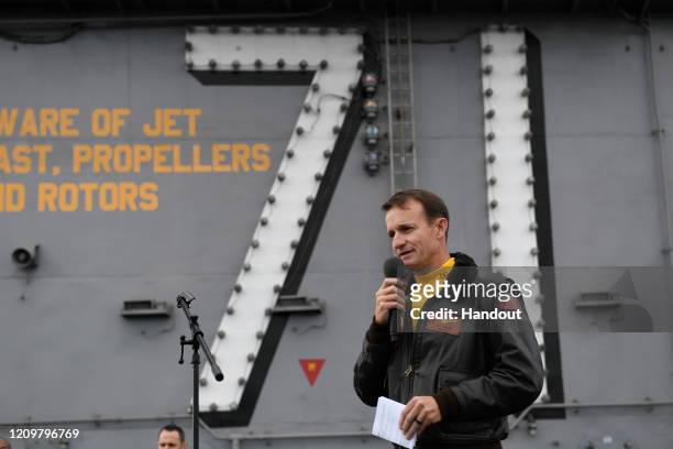 In this handout released by the U.S. Navy, Capt. Brett Crozier, commanding officer of the aircraft carrier USS Theodore Roosevelt , addresses the...