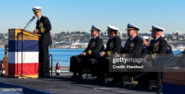 In this handout released by the U.S. Navy, Capt. Carlos Sardiello, commanding officer of the aircraft carrier USS Theodore Roosevelt , gives remarks...
