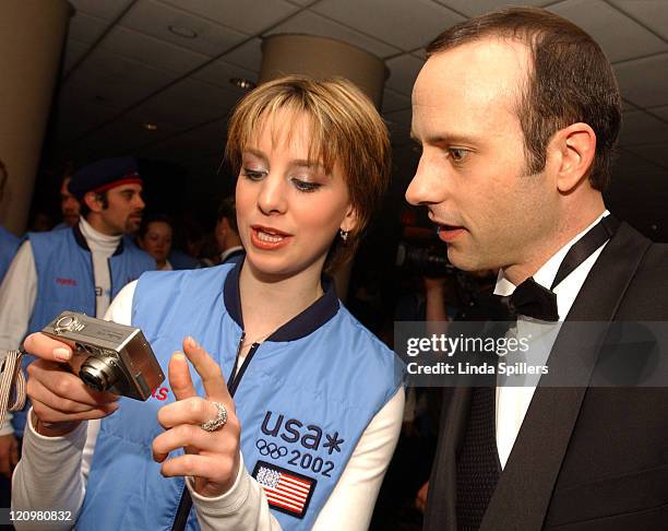 Gold medal figure skater Sarah Hughes and former Olympic figure skater Brian Boitano check out their photo taken by Hughes's mother, Monday, April 22...