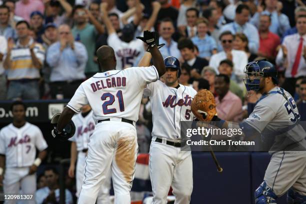 Carlos Delgado of the New York Mets celebrates his home run in the 4th inning against the Los Angeles Dodgers during game one of the 2006 National...