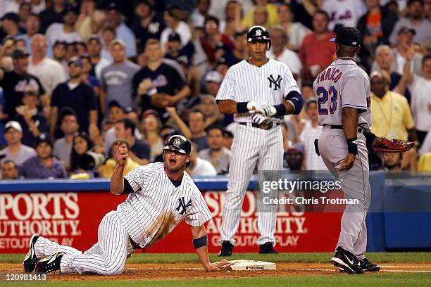 Jason Giambi of the New York Yankees is tagged out by Julio Franco of the New York Mets in the first inning at Yankee Stadium on July 2, 2006 in New...