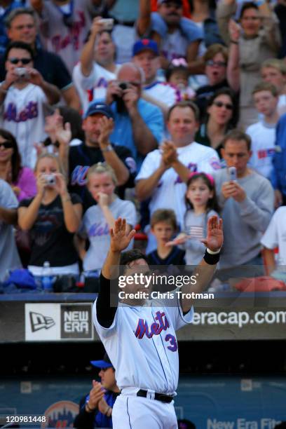 Mike Piazza catcher of the New York Mets acknowledges the crowd, during the 7th inning in possibly his last game as a New York Met at Shea Stadium on...