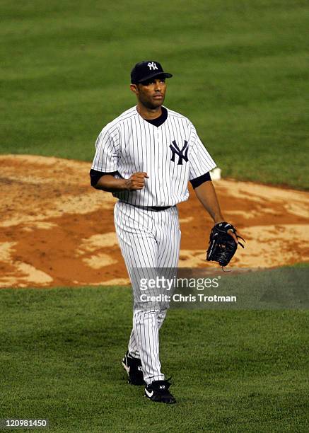 Mariano Rivera of the New York Yankees clenches his fist after closing out the New York Mets for victory at Yankee Stadium on June 30, 2006 in New...