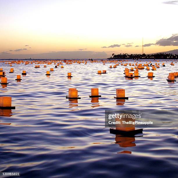 box lanterns floating in ocean - floating lanterns stock pictures, royalty-free photos & images