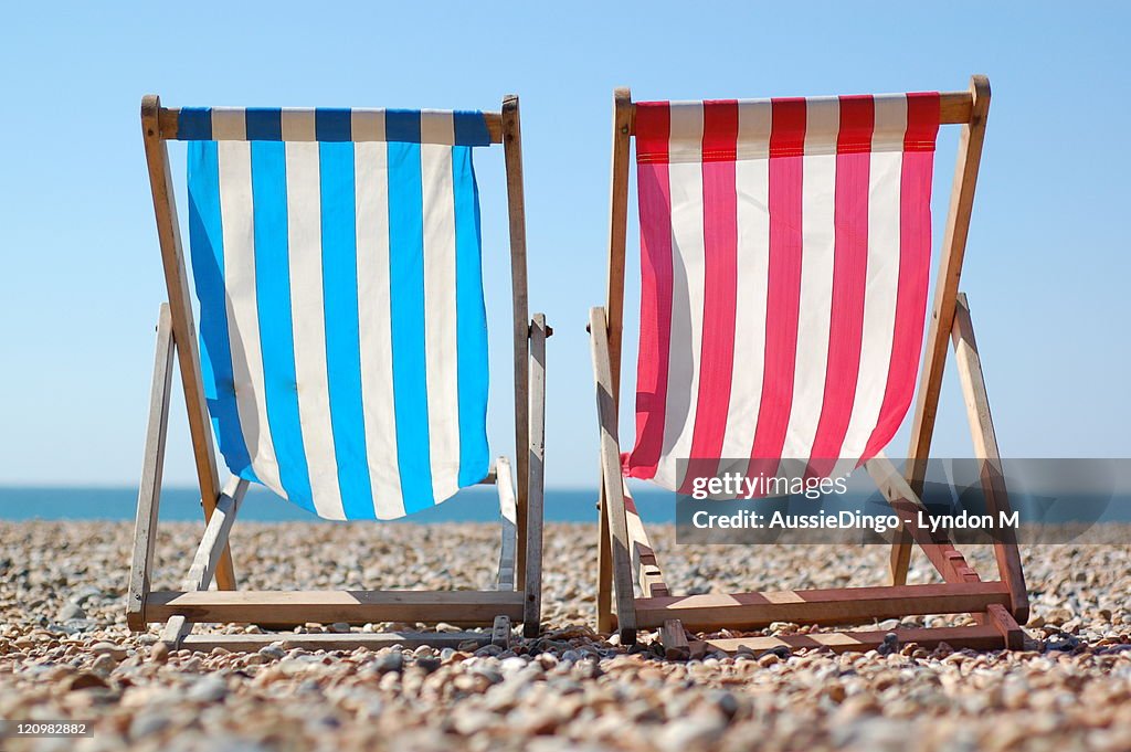 Deck chairs on Brighton beach, English Seaside