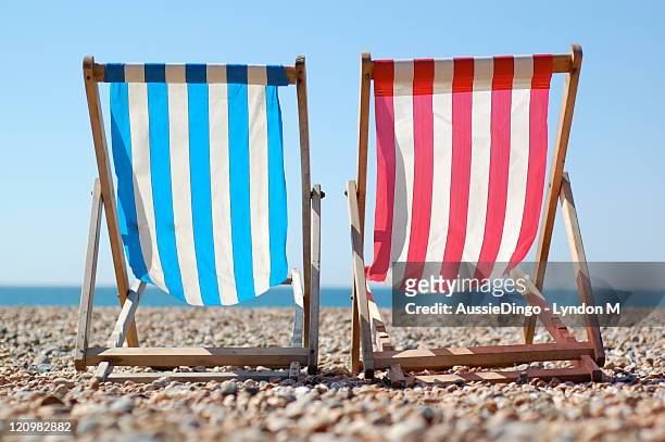 deck chairs on brighton beach, english seaside - deckchair stock pictures, royalty-free photos & images