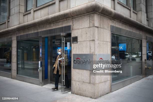 Customer wearing a protective mask exits a Citigroup Inc. Citibank branch in New York, U.S., on Friday, April 10, 2020. Citigroup is scheduled to...