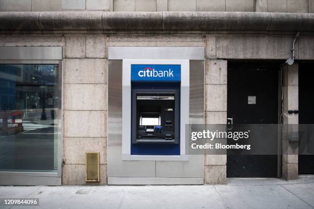 An automated teller machine is seen outside a temporarily closed Citigroup Inc. Citibank branch in New York, U.S., on Friday, April 10, 2020....