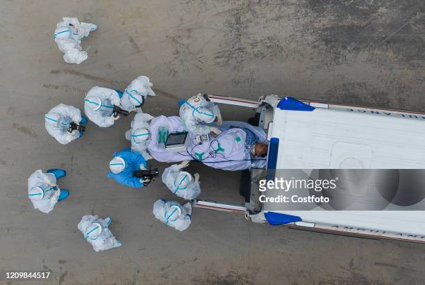 Ambulances carrying the last batch of patients leave leishenshan hospital and transfer to other hospitals, Wuhan City, Hubei Province, China, April...