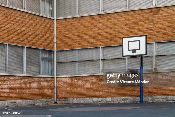 basketball court in school yard without basket - public school building stock pictures, royalty-free photos & images