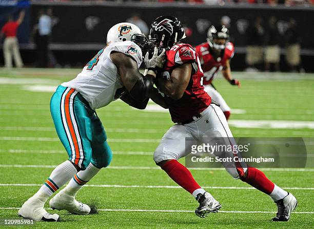 Ray Willis of the Miami Dolphins blocks against Cliff Matthews of the Atlanta Flacons during a preseason game at the Georgia Dome on August 12, 2011...
