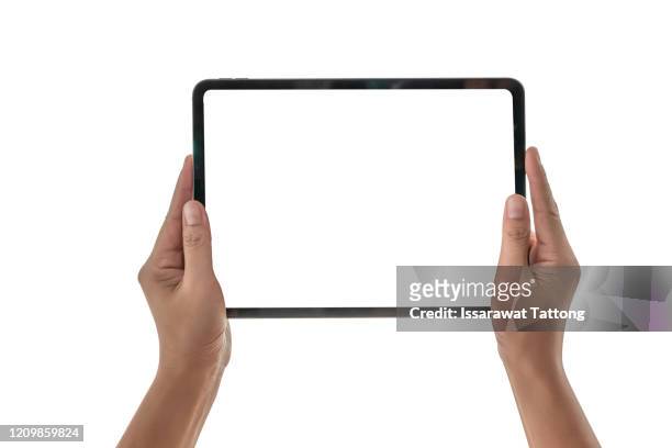 female hands holding a tablet computer gadget with isolated screen - tablet pc stock-fotos und bilder