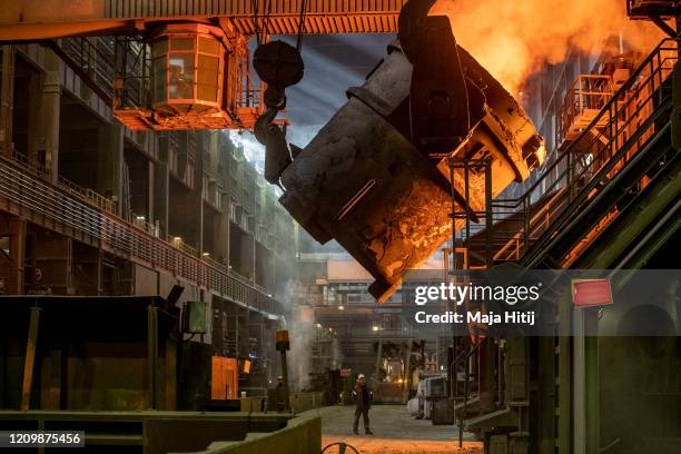 Ladle pours molten iron into a converter for creating steel at the Salzgitter AG steelworks on March 02, 2012 in Salzgitter, Germany. Salzgitter...