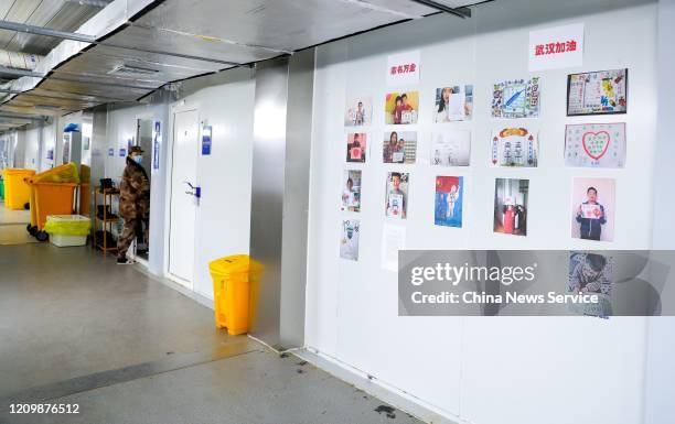 Photos of children and caricature paintings hang on the wall at the Huoshenshan makeshift hospital on March 2, 2020 in Wuhan, Hubei Province of China.