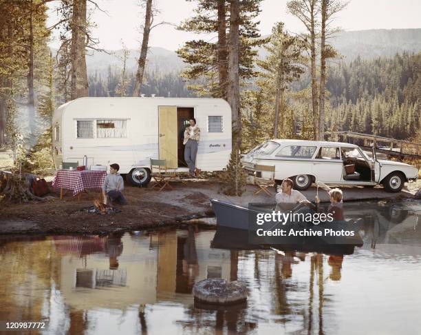 Family enjoying beside lake