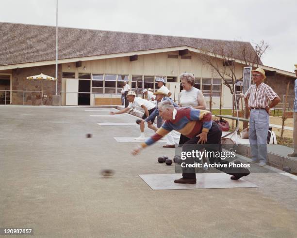 Senior people bowling, playing bocce ball