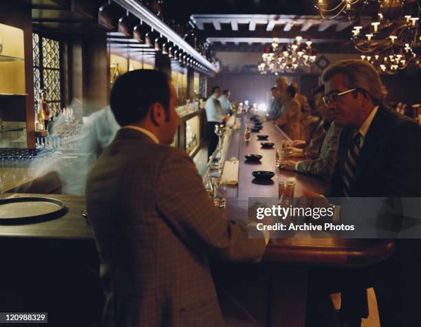 Businessmen sitting at bar