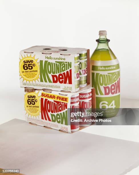 Mountain dew cartons and bottle against white background, close-up