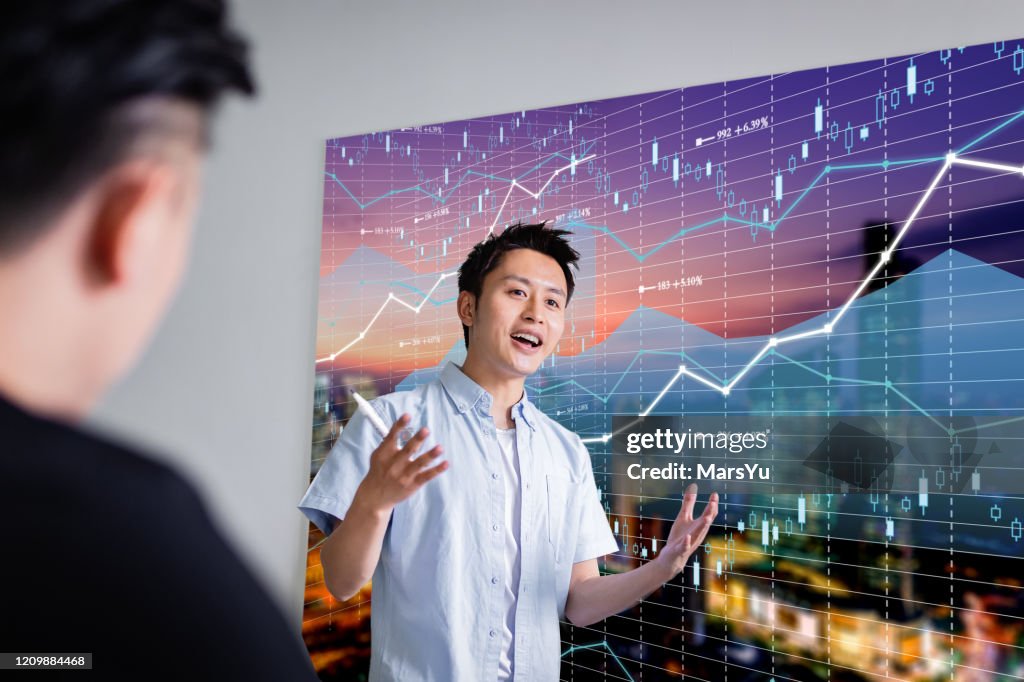 Businessman giving presentation on future plans to colleagues