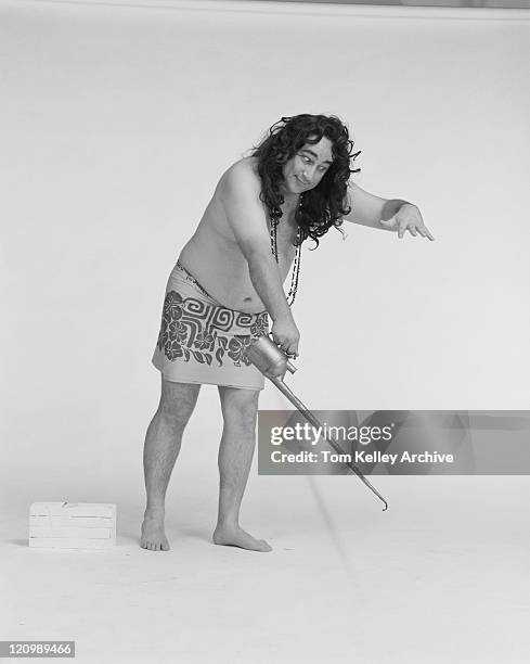 man holding oil can against white background - 1982 stock pictures, royalty-free photos & images