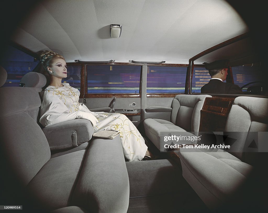 Young woman sitting in limousine