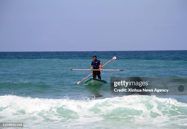 April 14, 2020 -- Palestinian fishermen go fishing on their boat in Deir al-Balah, central Gaza Strip, on April 7, 2020. TO GO WITH "Feature:...