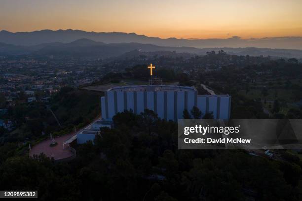 An aerial view shows Forest Lawn Memorial Park cemetery before sunrise as coronavirus infections accelerate on April 14, 2020 in Glendale,...