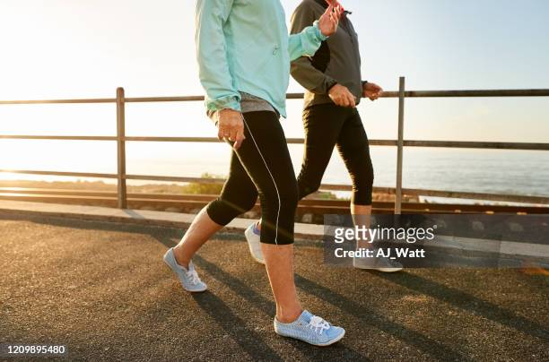 walking keeps you healthy - walking stock pictures, royalty-free photos & images