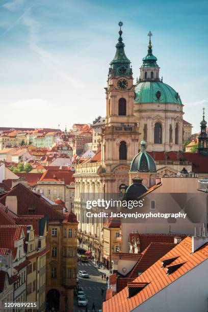 orange roofs of prague old town and town square with tourists seen from above, czech republic - praga fotografías e imágenes de stock