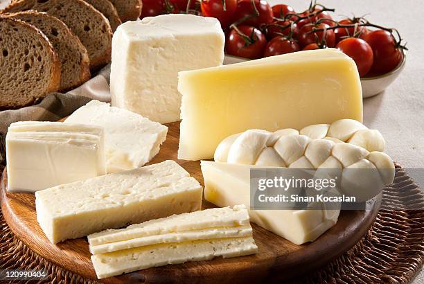 different types of cheese, bread and tomatoes - cheese stockfoto's en -beelden