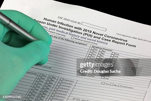 Cdc Form 129 Doctor Completing The Cdc Form For Reporting Coronavirus Investigation ...