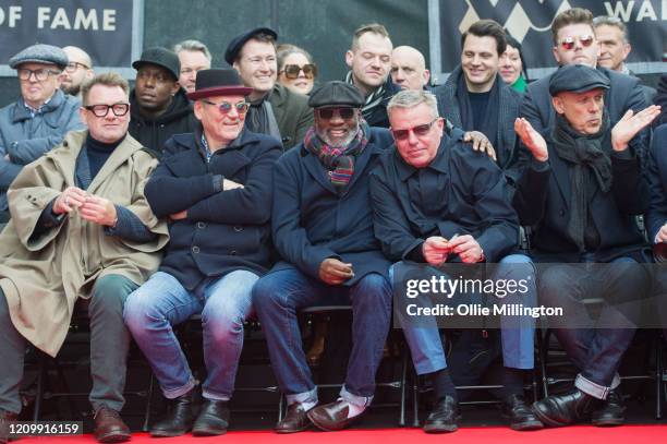 Mike Barson, Chas Smash, Lynval Golding , Graham McPherson aka Suggs, Mark Bedford and Dan Woodgate of Madness during their Music Walk Of Fame Stone...