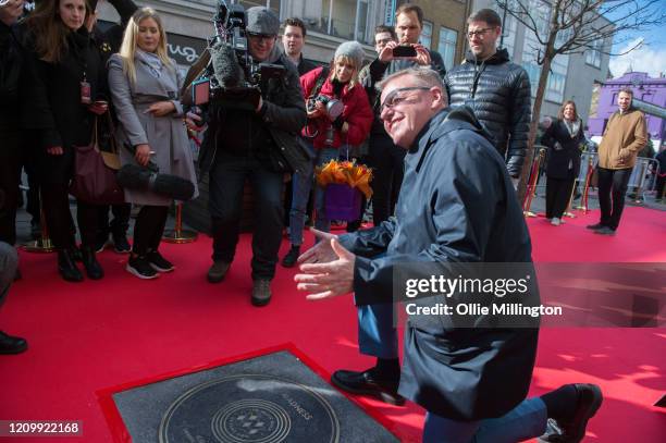 Graham McPherson aka Suggs of Madness during their Music Walk Of Fame stone unveiling, the second stone to be placed on Camden Highstreet on March...