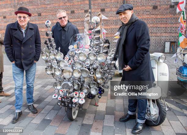 Mike Barson, Graham McPherson aka Suggs and Mark Bedford of Madness with a scooter belonging to a member of the Croxley Rebels Scooter Club after...