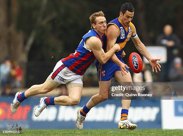 Lindsay Gilbee of Williamstown is tackled by Patrick Rose of Port Melbourne during the round 20 VFL match between Willimastown and Port Melbourne at...