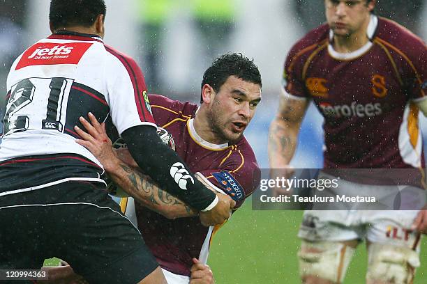 Kade Poki of Southland is tackled during the round nine ITM Cup match between Southland and North Harbour at Rugby Park on August 13, 2011 in...