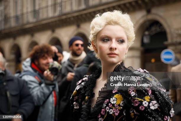 Lachlan Watson wearing floral spangled dress outside Giambattista Valli during Paris Fashion Week Womenswear Fall/Winter 2020/2021 Day Eight on March...